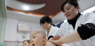 Chinese children playing in a park as the government offers birth incentives to support families