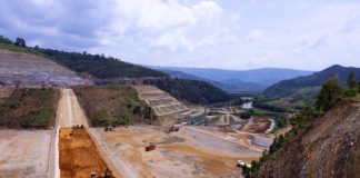Nyabarongo II Dam under construction with machinery and water channels visible