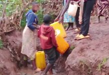Rusizi Residents Struggle | Many Still Lack Water and Electricity Rusizi residents walking in a village area without water and electricity.