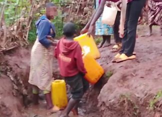 Rusizi Residents Struggle | Many Still Lack Water and Electricity Rusizi residents walking in a village area without water and electricity.