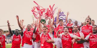Arsenal players celebrating after winning the Premier League trophy in 2026