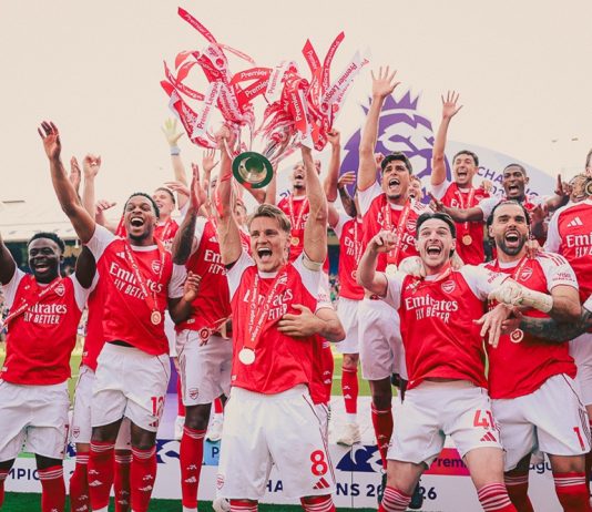 Arsenal players celebrating after winning the Premier League trophy in 2026