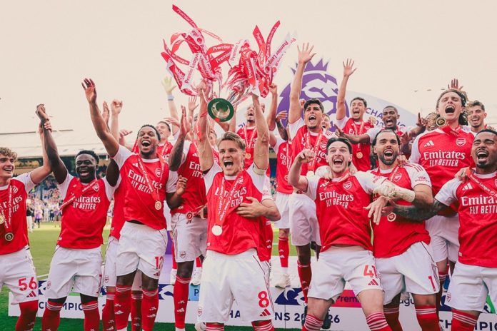 Arsenal players celebrating after winning the Premier League trophy in 2026
