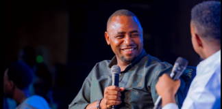 Minister Uwihanganye speaking during Gen-Z Comedy while discussing King James concert success